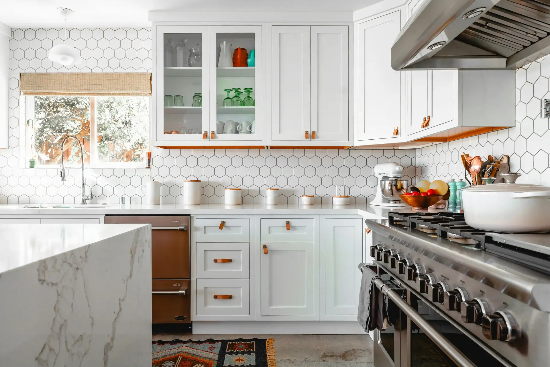 White kitchen with a white hexagon tile backsplash
