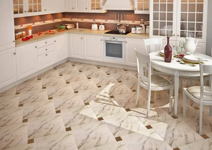 Kitchen floor in diagonal marble-look tile with dark accent dots