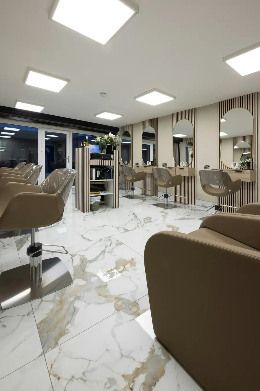 Salon interior with marble-look porcelain floor tile